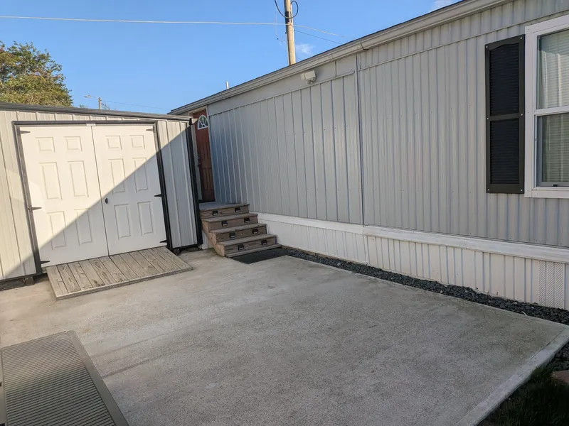 New concrete pad below the addition's door